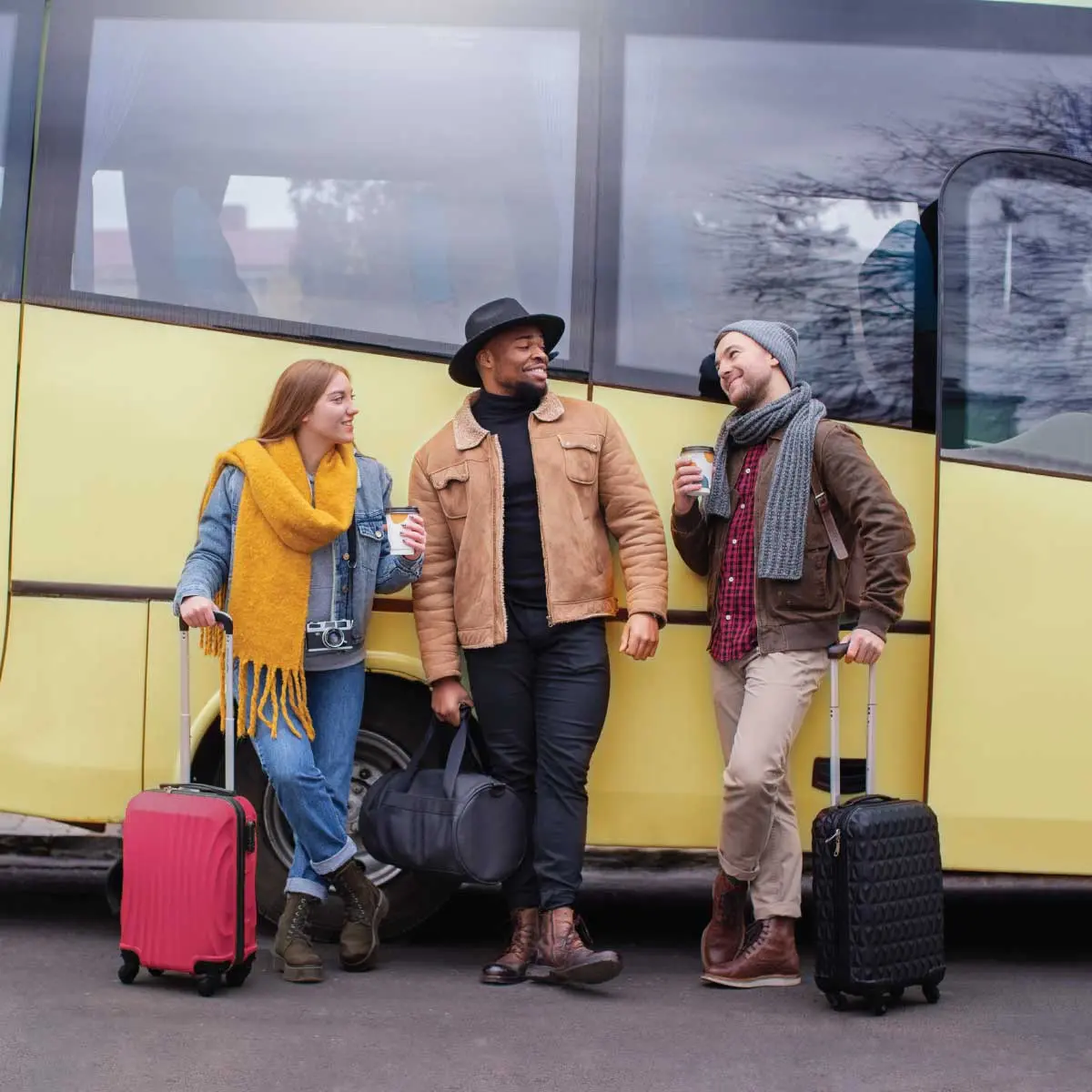 Smiling mechanic holding a tool